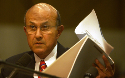 Sheriff Lee Baca is questioned by L.A. County Supervisor Gloria Molina about an inmate death at the Men's Central Jail.
