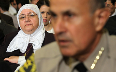 Samira Hussein of Gaithersburg, Md., listens as Baca testifies during a hearing before the House Homeland Security Committee on March 10, 2011, in Washington, D.C.  Baca defended his work with Muslim groups before Congress and elsewhere.