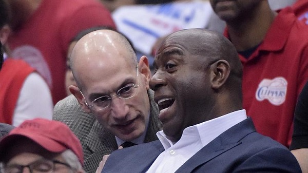 Magic Johnson and NBA Commissioner Adam Silver at Game 4 of the Western Conference semifinal NBA basketball playoff series on Sunday. 
