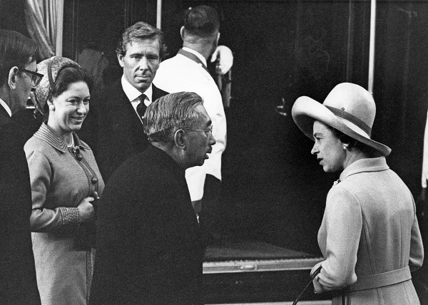 Queen Elizabeth II chats with Emperor Hirohito of Japan at Victoria Station at the start of his four-day state visit to London on Oct. 5, 1971. On the left are the queen's sister, Princess Margaret, and her husband, Antony Armstrong-Jones, 1st Earl of Snowdon.