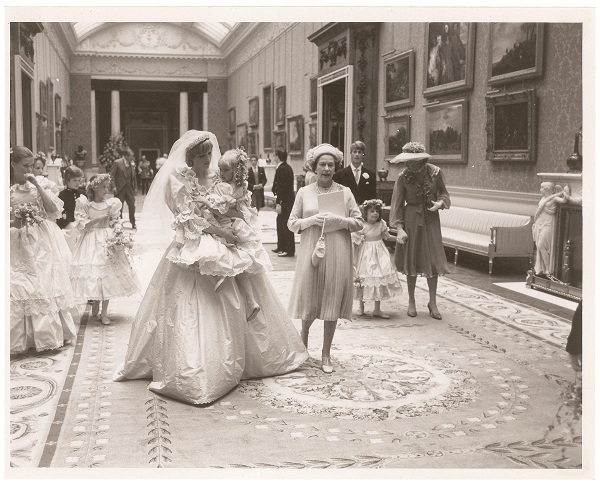 Princess Diana, holding 5-year-old bridesmaid Clementine Hambro, with Queen Elizabeth II at Buckingham Palace following her wedding to Prince Charles on July 29, 1981.