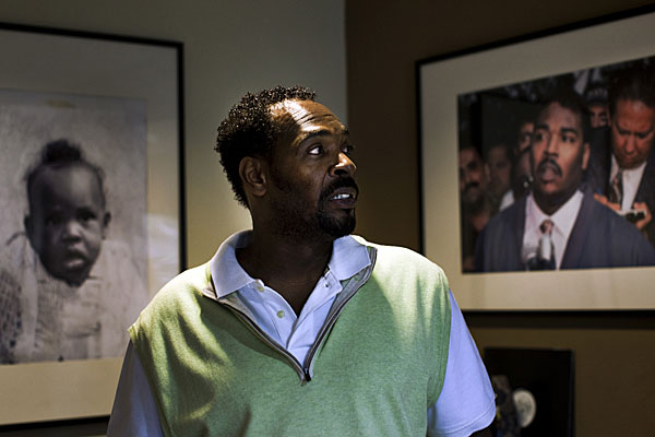 Rodney G. King looks at photograph of himself from May 1, 1992.