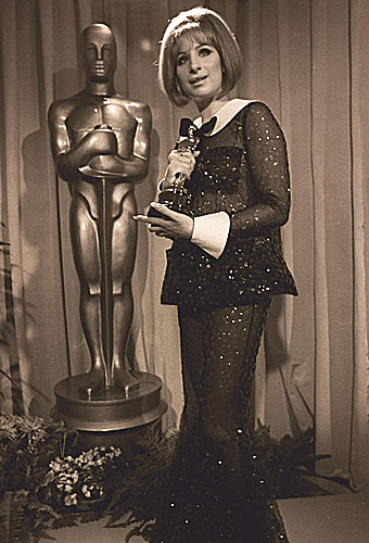 Oscar winner Barbra Streisand sports a transparent bell bottom jumpsuit.