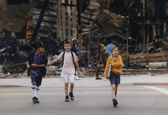 Students cross the street on their way to classes at the Budlong Avenue Elementary School. (May 4, 1992)