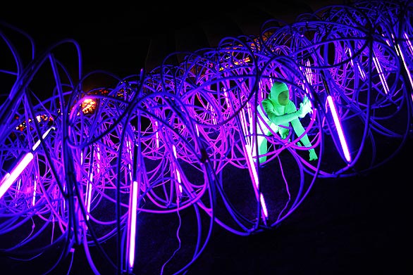 Rob Andrews crawls through the Elastic Plastic Sponge.