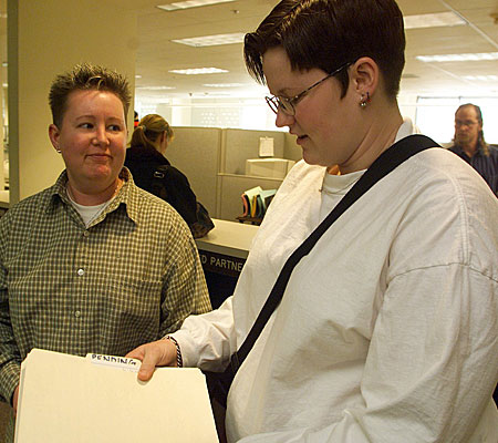 Lori and Liz Love of Davis, Calif., talk over the decision to register with the state as domestic partners.