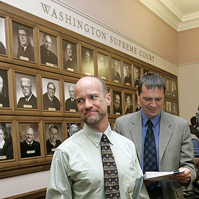 Alan Fuller, left, leaves court with partner Jeff Kingsbury after justices upheld the state's gay-marriage ban.