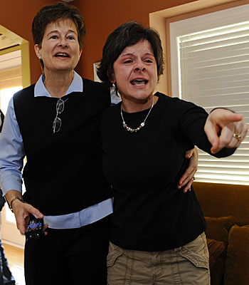 Nancy Robinson, left, and Laura Fefchak celebrate the state Supreme Court decision with friends.