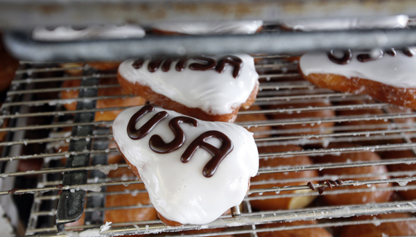 As the space shuttle Endeavour is moved from LAX to the Science Center it will pass Randy's Donuts at the corner of Manchester and La Cienega. The shop sold shuttle shaped doughnuts on Thursday, but will be closed during the event.
