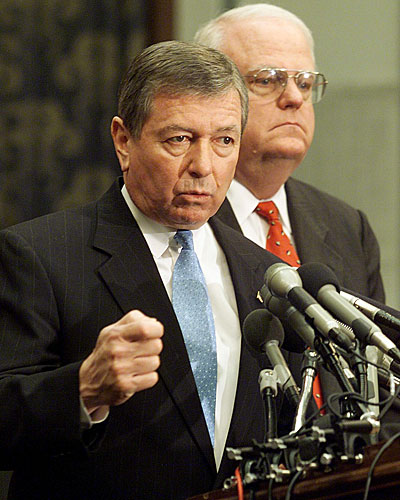 Atty. Gen. John Ashcroft calls the vote "an important first step." Behind Ashcroft is Rep. F. James Sensenbrenner Jr. (R-Wis.).